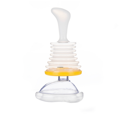 White and clear plastic tool with a yellow component on a white background. Mouth piece for breathing apparatus 