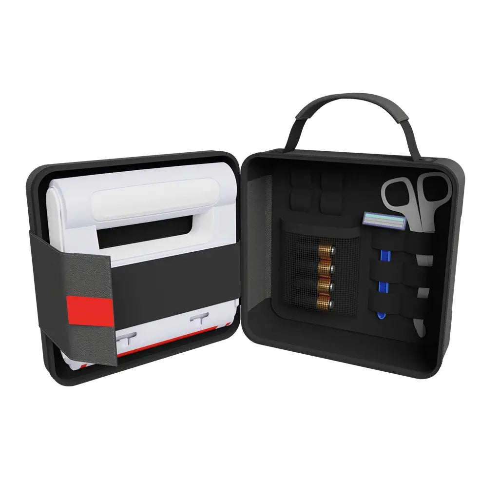 Open black travel case with various items including a razor, toiletries, and a pen on a white background.