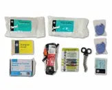 Collection of medical wound supplies. including dressing and scissors