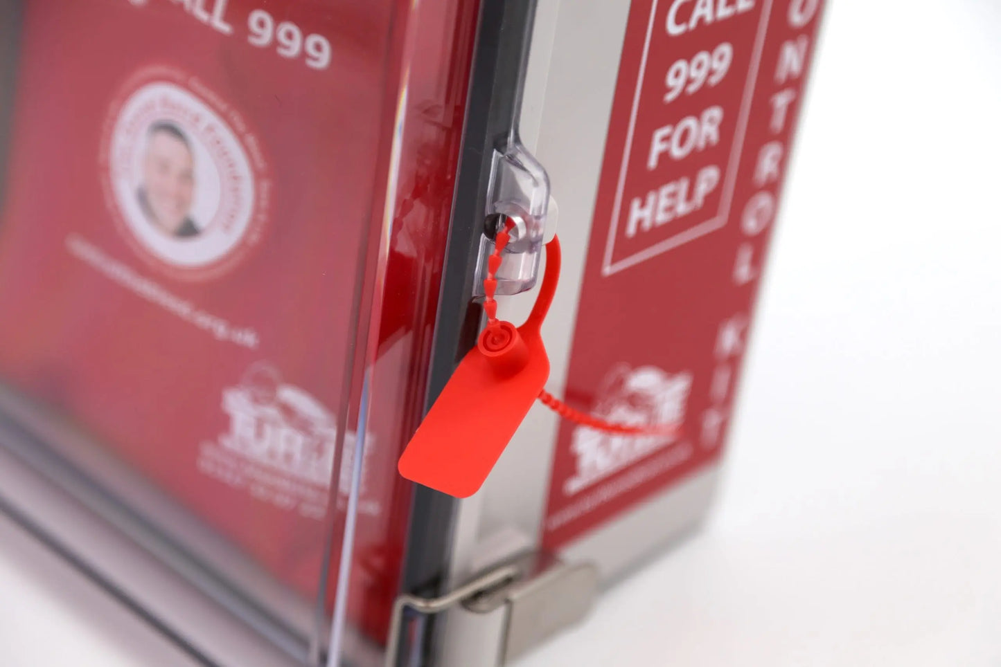 Red first aid kit with a lock on a white background