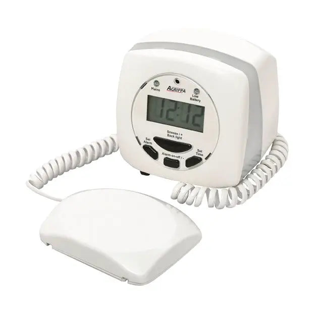 White electronic device with digital display and coiled cord on a white background