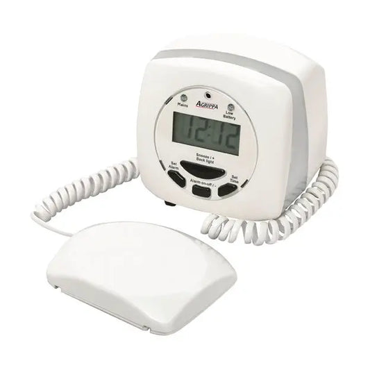 White electronic device with digital display and coiled cord on a white background