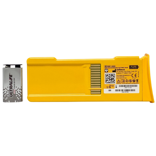 Yellow defibtech battery pack with a smaller UltraLife battery on a white background