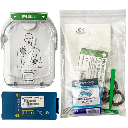 First aid kit components including a face shield, gloves, and blue defibrillator battery and white electrode pads
