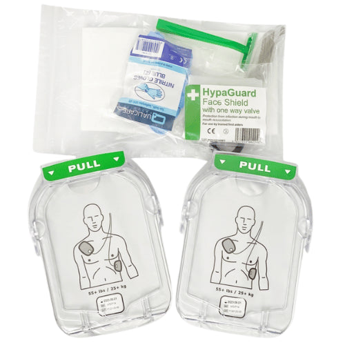Two AED electrode pads with a HypaGuard face shield packaging on a white background
