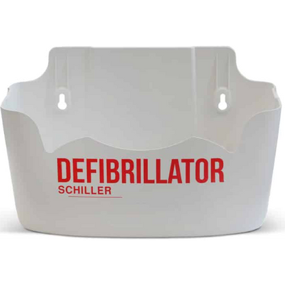 White defibrillator wall mount with 'DEFIBRILLATOR SCHILLER' text on a white background